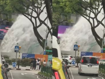 Screengrabs from a video on Facebook showing a large geyser of water outside *Scape mall in Orchard Road.