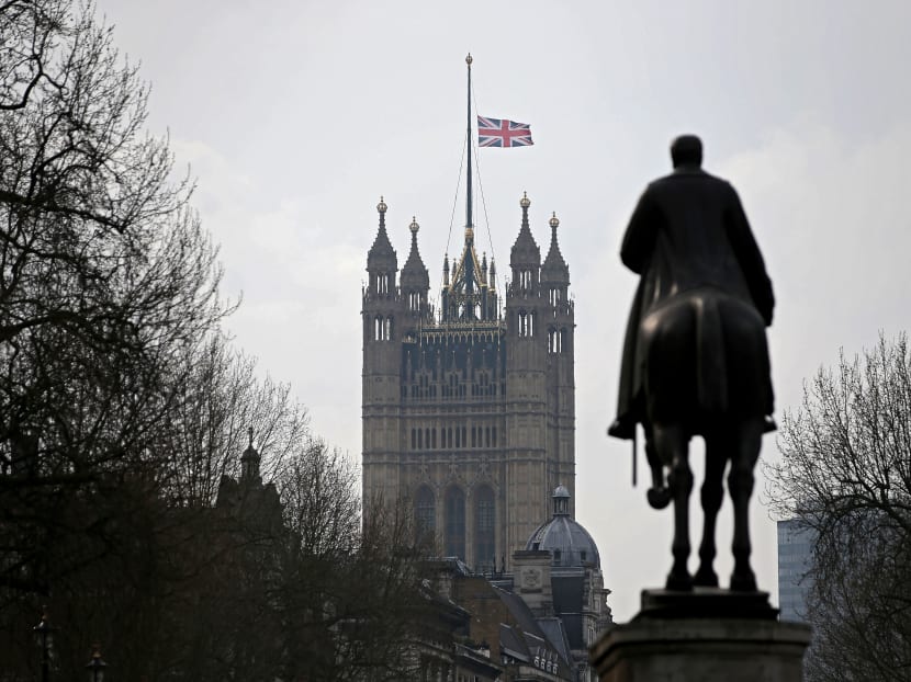 A Union flag flying at half-mast from the Houses of Parliament on March 23, 2017. Seven people have been arrested over Wednesday’s terror attack at the British Parliament. Photo: AFP