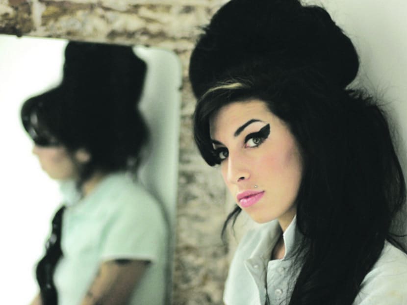 In this 2007 file photo, British singer Amy Winehouse poses for photographs after being interviewed by The Associated Press at a studio in north London. Photo: AP