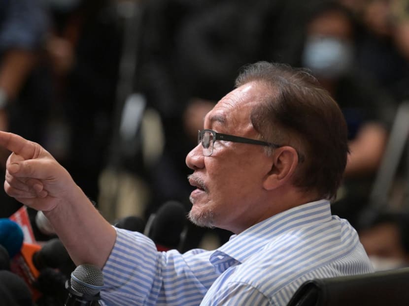 Malaysian opposition leader Anwar Ibrahim gestures during a press conference at a hotel in Kuala Lumpur on Mar 16, 2021.
