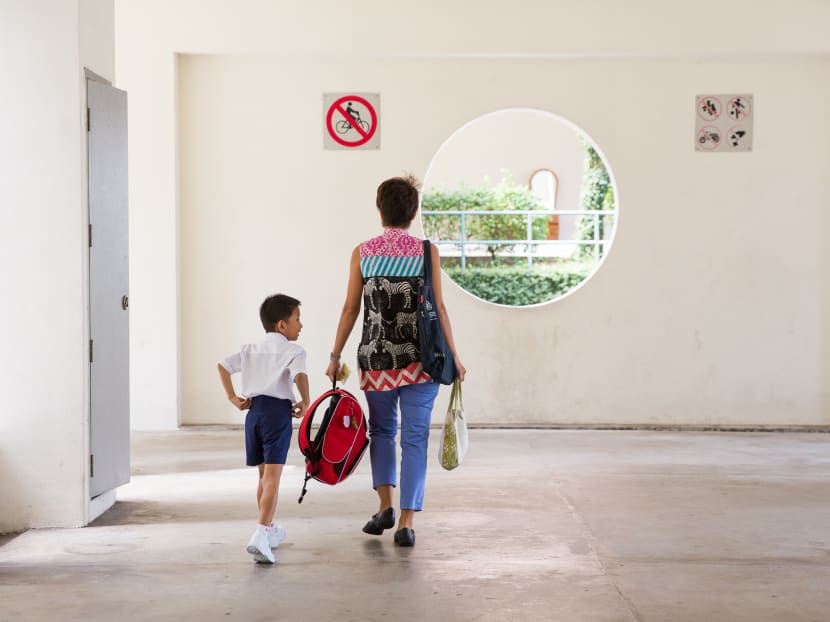 The author with her son when he first entered primary school in 2014. The author was determined then not to be a helicopter mom.