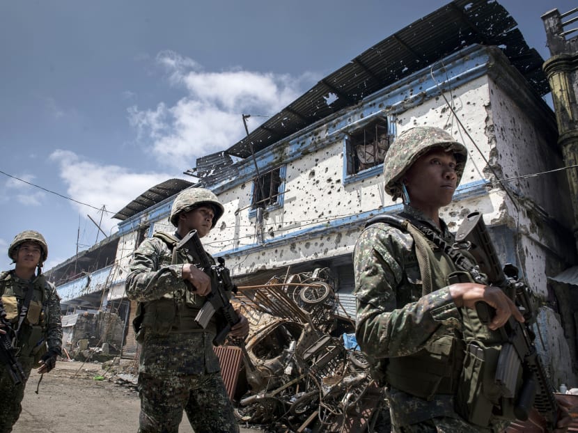 Philippine soldiers patrolling a part of Marawi recently seized from militants loyal to Islamic State. The author says one concern of concern is the ability of violent extremist recruiters to fish in these troubled waters.  Photo: The New York Times