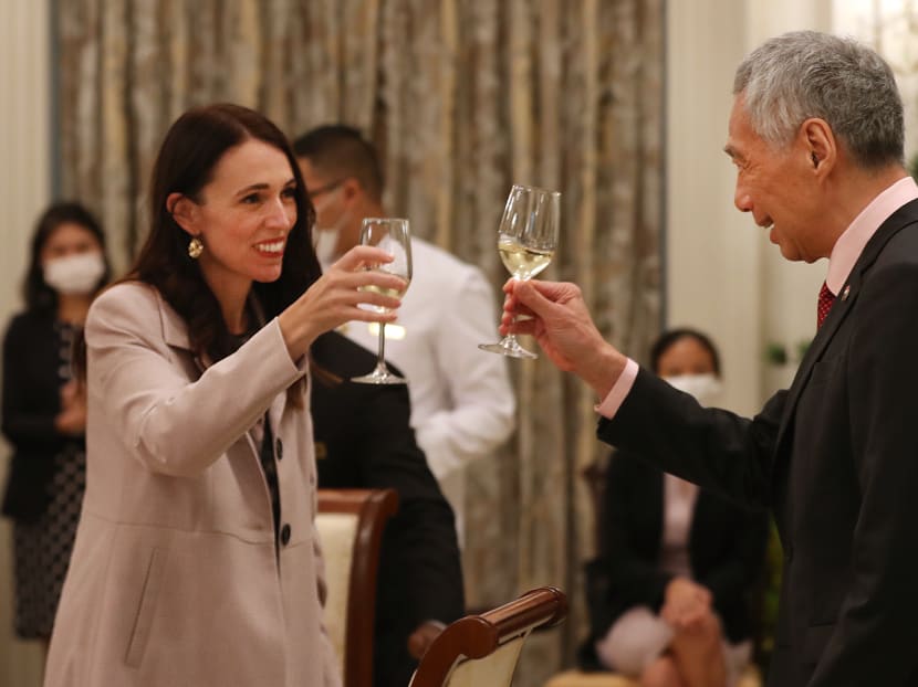 New Zealand Prime Minister Jacinda Ardern (left) and Prime Minister Lee Hsien Loong raise their glasses to strong bilateral relations as they meet on April 19, 2022.