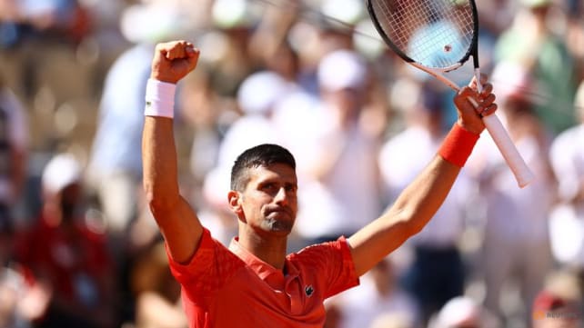 Djokovic edges closer to Grand Slam record with spot in last eight