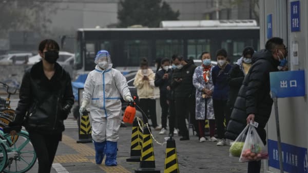 China reports new daily record COVID-19 cases, curbs tighten across country