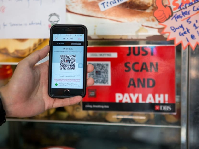 A TODAY reader says that in the face of Singapore's drive to be a cashless society, it is counterproductive to impose extra charges on consumers who support cashless payments. Photo: DBS