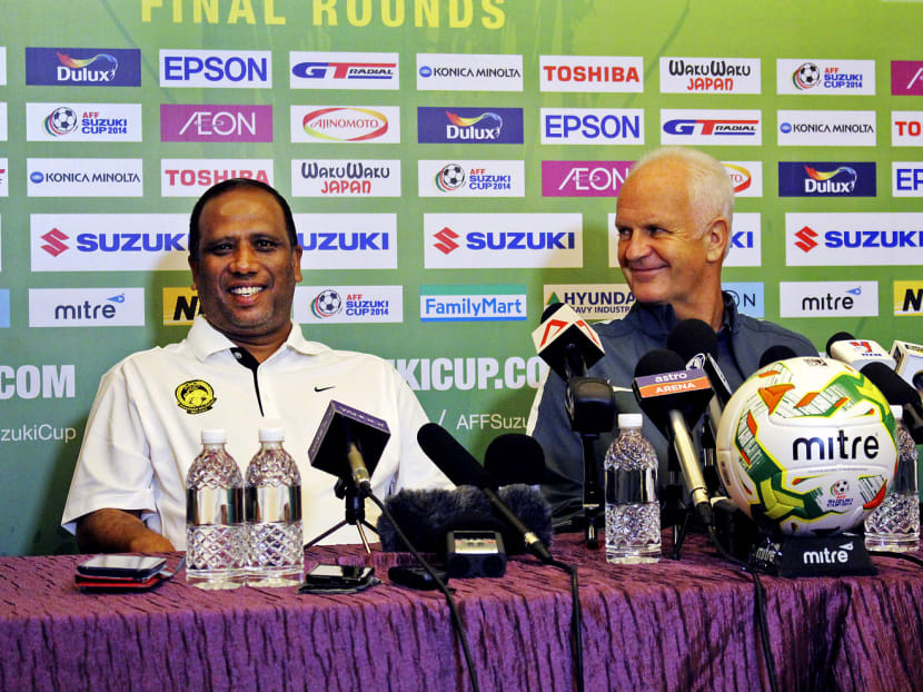 Malaysia coach Dollah Salleh (left) and Singapore coach Bernd Stange have their sights set on the same prize. Photo: EMMANUEL PHUA
