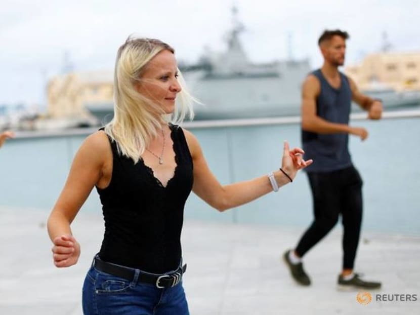 Sun-seekers enjoy European summer 'workcation' before office return Sun-seekers enjoy European summer 'workcation' before office return