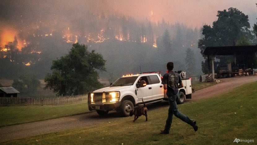 Heat, wind threaten to whip up growing western US wildfires Heat, wind threaten to whip up growing western US wildfires