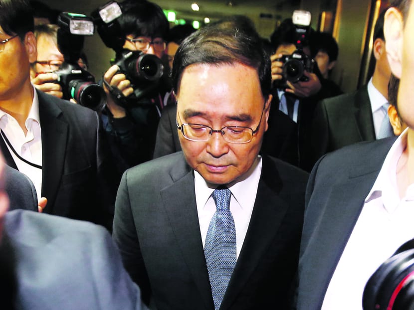 Mr Chung (centre) blamed ‘deep-rooted evils’ in society for the tragedy. PHOTO: REUTERS