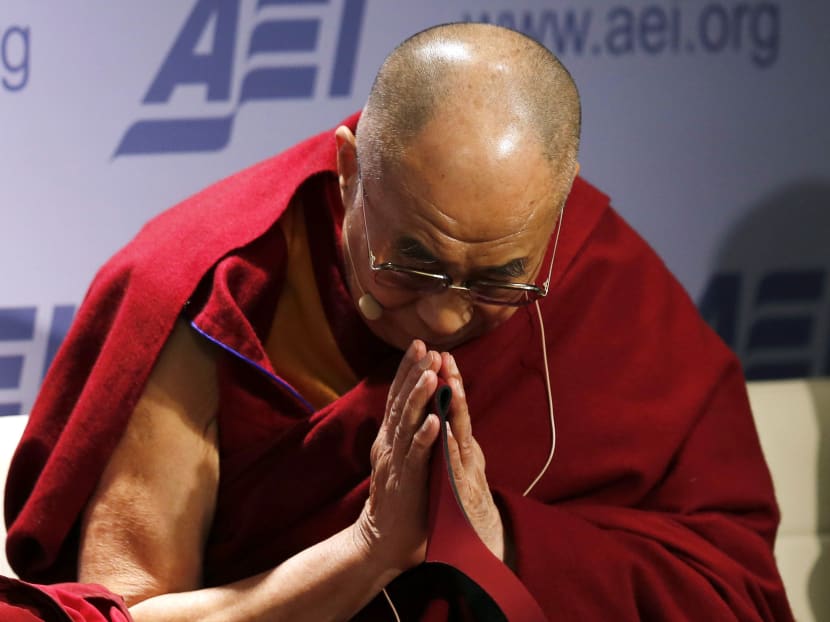 The Dalai Lama greets the audience at the American Enterprise Institute in Washington Feb 20, 2014. Photo: Reuters