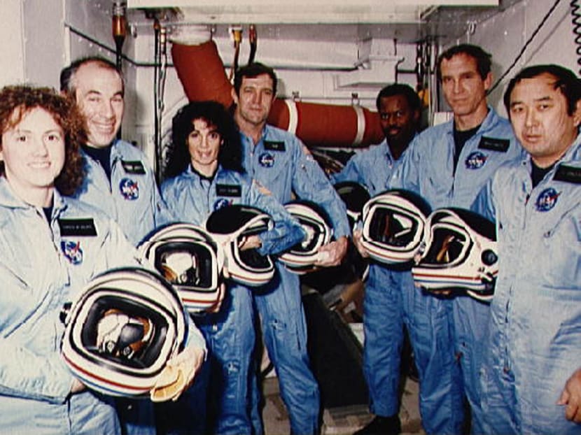 US remembers astronauts killed, pledges to reach Mars