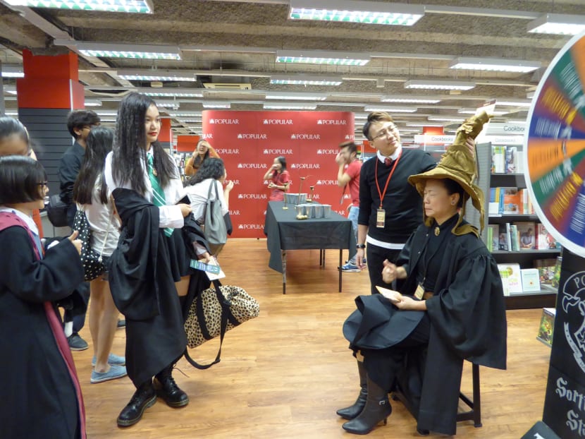Patrons at Popular bookstore's Pop@Central got a chance to try out the Sorting Hat Station, among other goodies that were prepared for the launch of the latest Harry Potter novel, Harry Potter And The Cursed Child. Photo: Joy Fang.