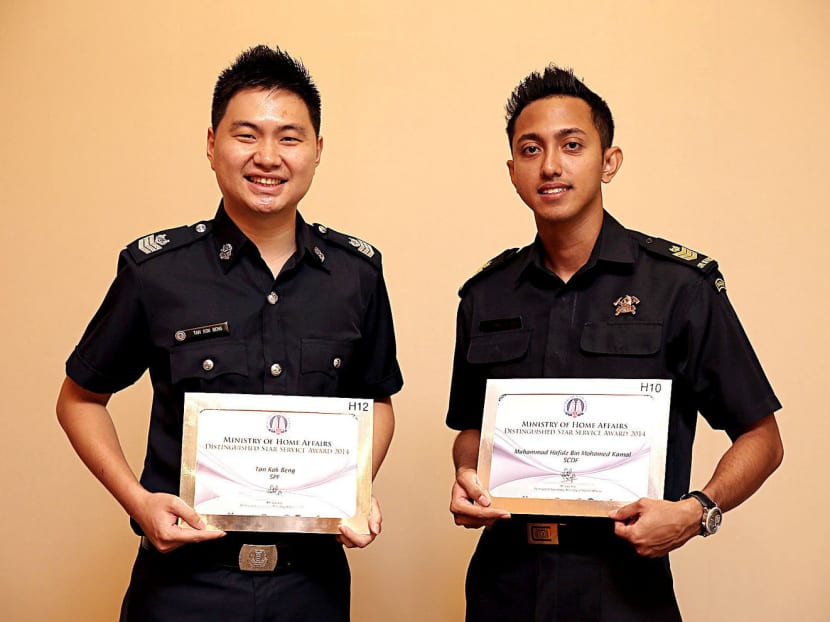 Staff Sergeants Tan Kok Beng (left) and Muhammad Hafidz received the 
MHA Star Service Award at the MFA’s Excel Fest yesterday. Photo: Wee Teck Hian