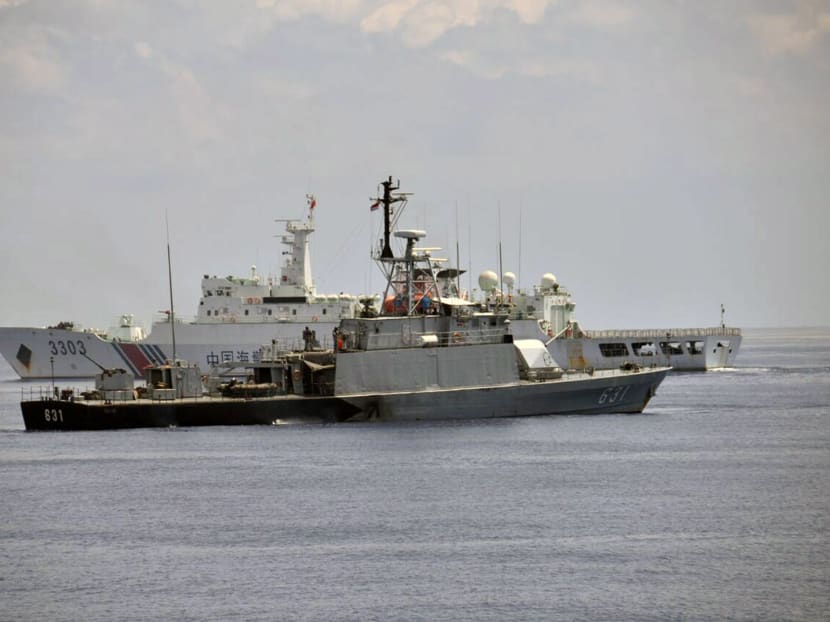 Indonesian navy vessel KRI Todak (F) is seen next to a Chinese Coast Guard vessel (B) while it was trying to detain the fishing boat Han Tan Cou in the waters near Natuna Islands, Riau Islands province, Indonesia, June 17, 2016 in this Indonesian Navy handout photo provided by Antara Foto.