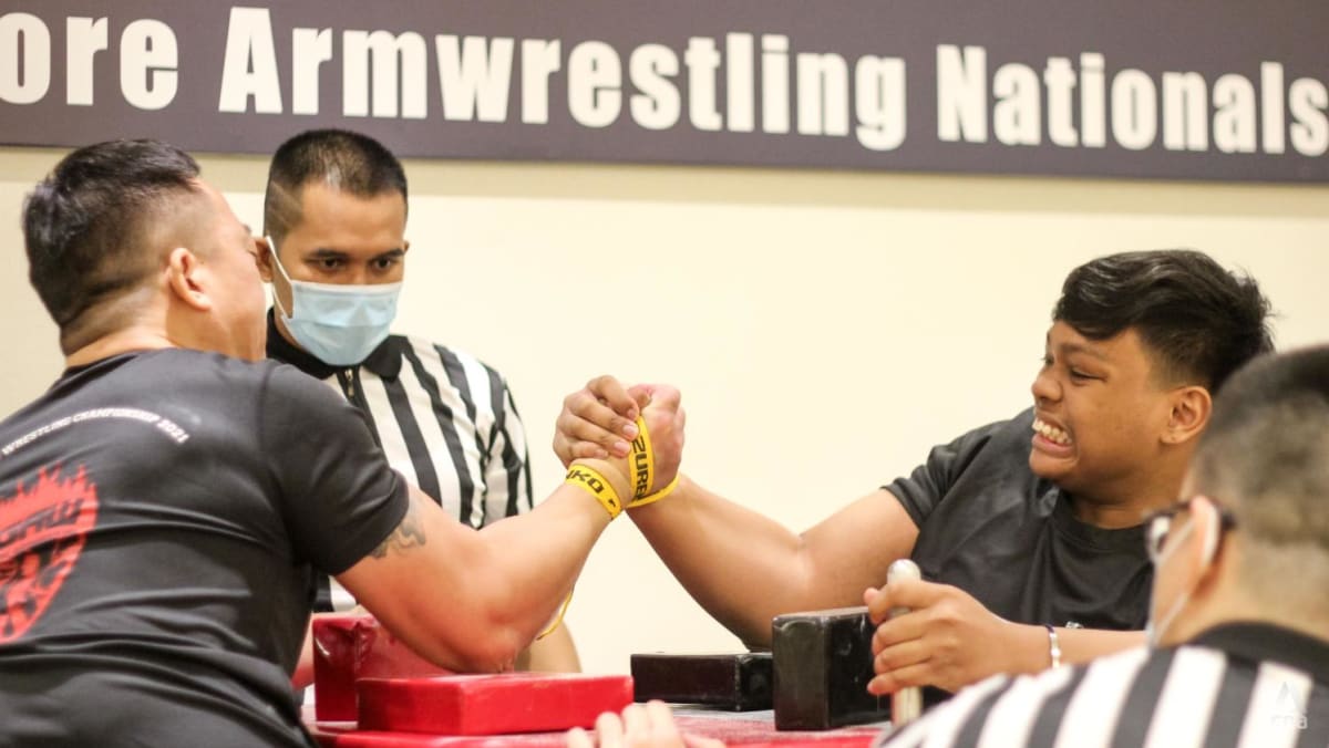 flexing-muscles-to-grow-the-sport-singapore-s-arm-wrestlers-face-off-at-first-national-championships