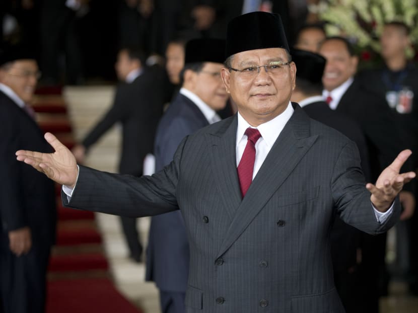 Prabowo Subianto, a political rival to Indonesia's seventh President Joko Widodo's gestures as he arrives ahead of Widodo's inauguration at Parliament in Jakarta, Indonesia, Monday, Oct 20, 2014. Photo: AP