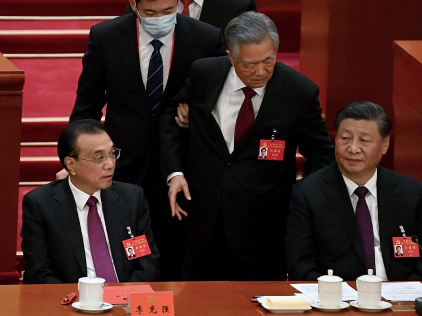 China's President Xi Jinping (right) sits besides Premier Li Keqiang (left) as former president Hu Jintao (centre) is assisted to leave from the closing ceremony of the 20th China's Communist Party's Congress at the Great Hall of the People in Beijing on Oct 22, 2022.
China's President Xi Jinping (right) sits besides Premier Li Keqiang (left) as former president Hu Jintao (centre) is assisted to leave from the closing ceremony of the 20th China's Communist Party's Congress at the Great Hall of the People in Beijing on Oct 22, 2022.
