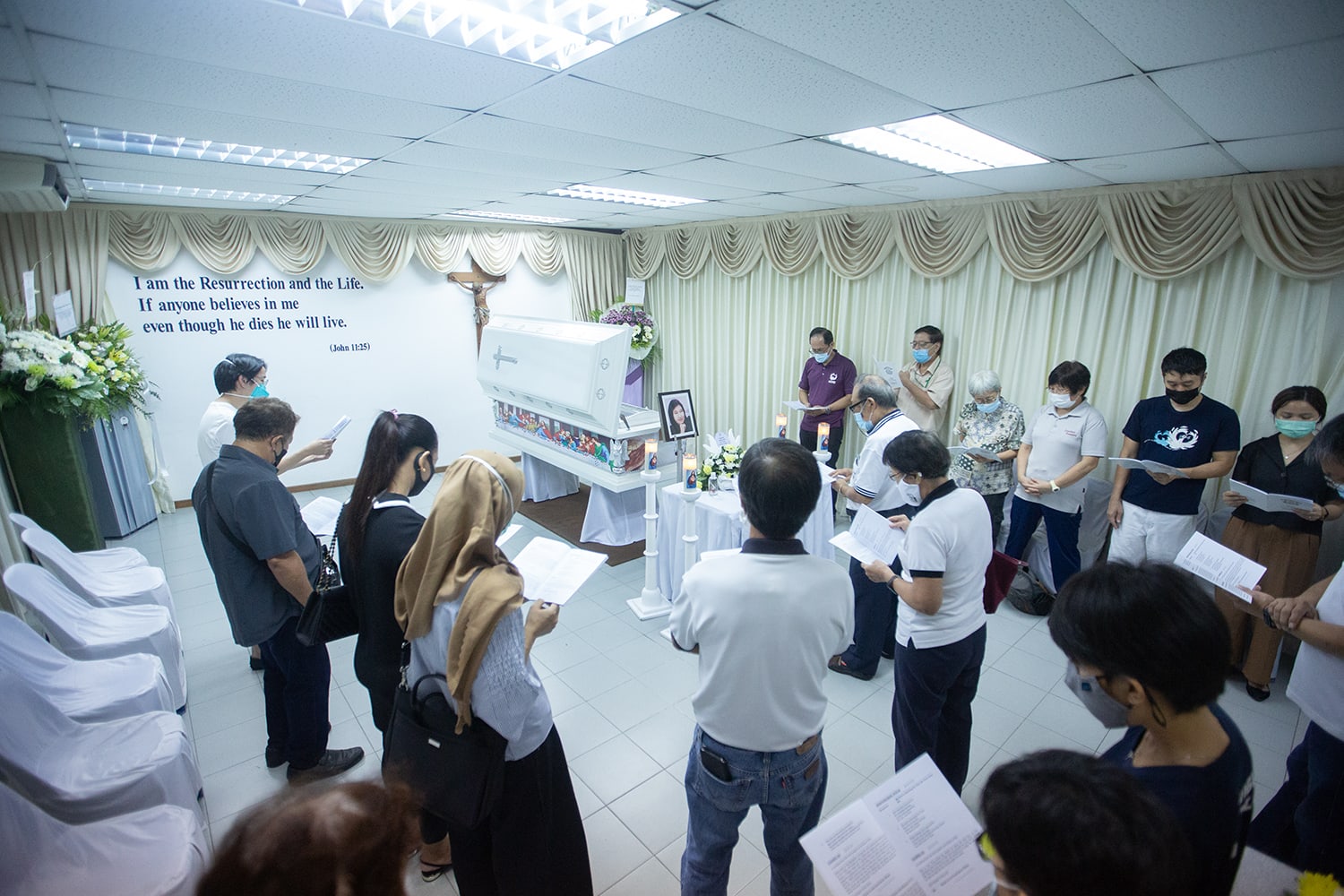 Family and visitors praying at the funeral wake of Home's founder Bridget Tan on April 22, 2022. Family and visitors praying at the funeral wake of Home's founder Bridget Tan on April 22, 2022.