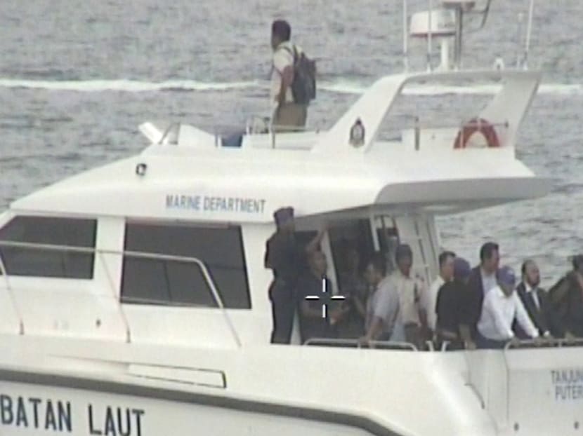 Johor's chief minister Osman Sapian and his entourage on board Malaysia Marine Department (MMD) vessel Tanjung Puteri in transit to MMD vessel Pedoman.