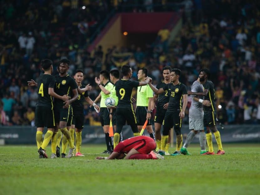 A Singapore player reacts after the loss to Malaysia at the SEA Games. Photo: Jason Quah/TODAY