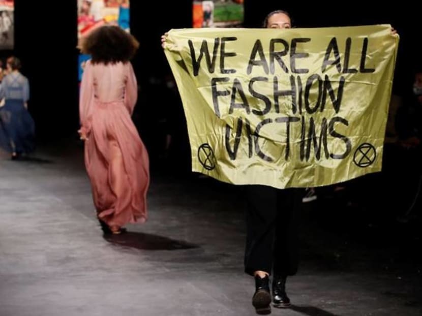 Environmental protester crashes Dior runway show at Paris Fashion Week Environmental protester crashes Dior runway show at Paris Fashion Week