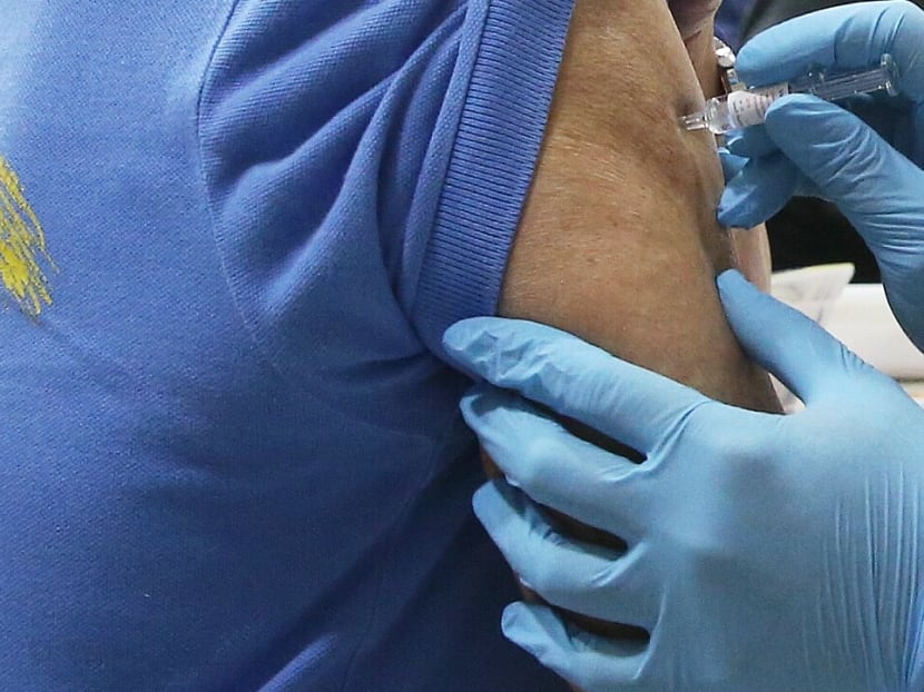 A senior receiving a flu vaccine in 2019.