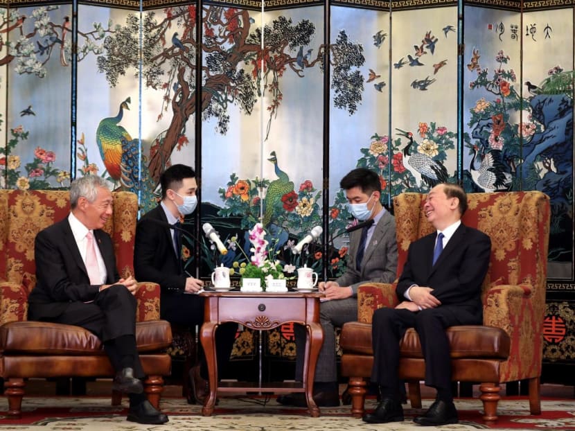 Prime Minister Lee Hsien Loong (far left) meeting Mr Huang Kunming (far right), Guangdong Party Secretary, in Guangzhou, China on March 29, 2023. 