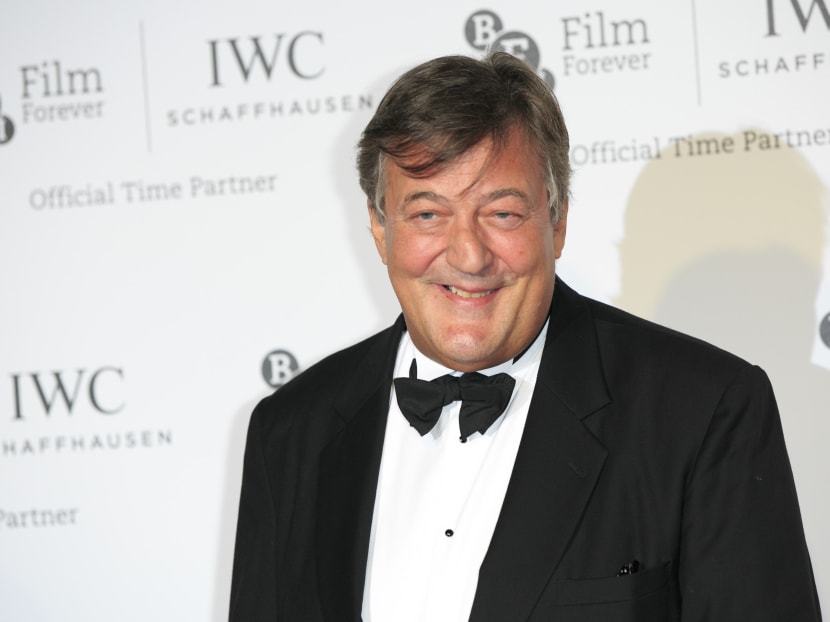 In this Oct 7, 2014, file photo, Stephen Fry poses for photographers upon arrival at the British Film Institute London Film Festival Gala Dinner in central London. Photo: AP/Invision