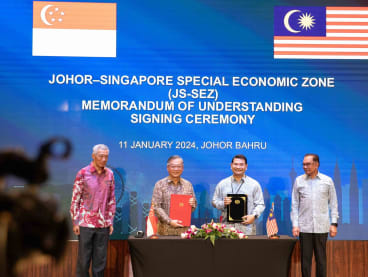 (From left) Singapore's Prime Minister Lee Hsien Loong, Singapore's Trade and Industry Minister Gan Kim Yong, Malaysia's Economy Minister Rafizi Ramli and Malaysia's Prime Minister Anwar Ibrahim at the signing of a Memorandum of Understanding on the Johor-Singapore Special Economic Zone on Jan 11, 2024.