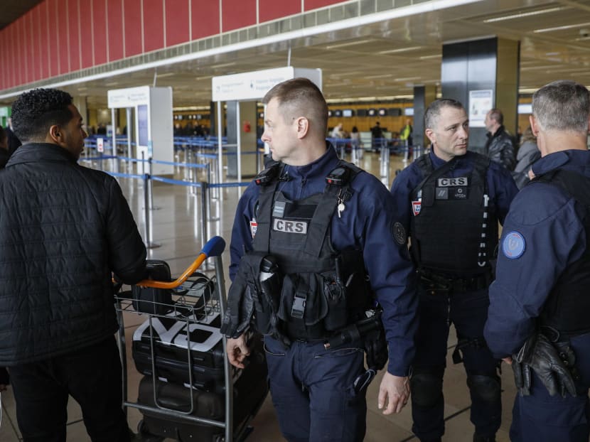 Riot police officers patrol inside Orly airport, south of Paris, as flights began to resume, Saturday, March, 18, 2017. French soldiers shot and killed a man who wrestled a colleague to the ground Saturday and tried to steal her rifle at Paris’ Orly Airport. Photo: AP