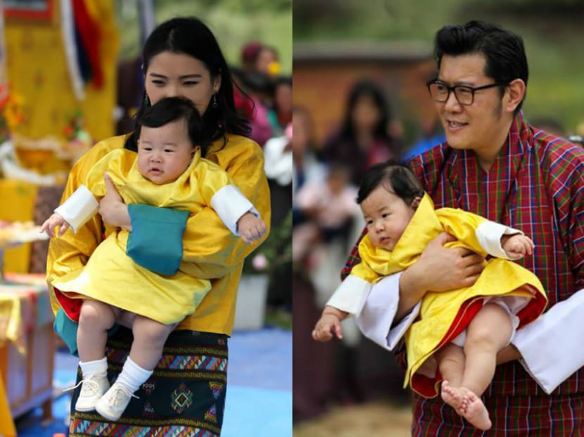 Photos of Queen Jetsun Pema and King Jigme Khesar Namgyel Wangchuck carrying their first son, Prince Jigme Namgyel Wangchuck, were shared on their Facebook pages on Aug 9, 2016. Photo: Facebook/QueenJetsun and Facebook/KingJigmeKhesar (right to left)