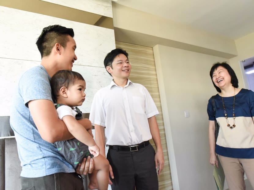Minister for National Development Lawrence Wong visited families who have moved into the Tampines Greenlace BTO development today (Dec 30). Photo: Channel NewsAsia