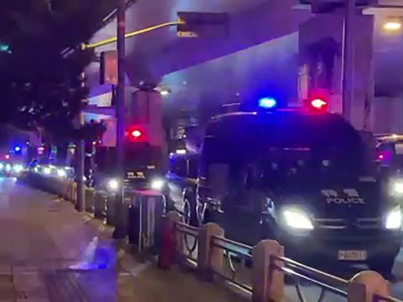 This frame grab taken from video on Nov 27, 2022 by an anonymous source shows a line of police vehicles during protests against China's Covid-19 restrictions in Shanghai.
This frame grab taken from video on Nov 27, 2022 by an anonymous source shows a line of police vehicles during protests against China's Covid-19 restrictions in Shanghai.