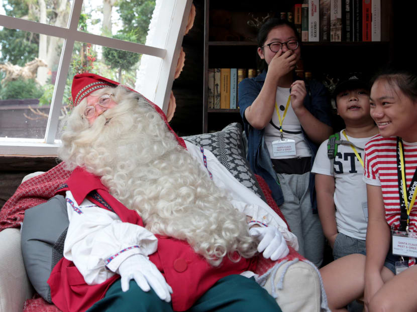 Photo of the day: Santa Claus meets children from Hope Centre (Singapore) in his cabin in Gardens by the Bay’s Flower Dome on Thursday (Dec 7). Photo: Jason Quah/TODAY