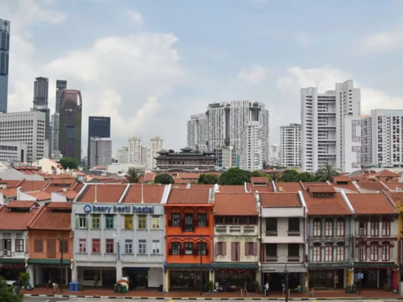 File photo of high-rise buildings overlooking old shophouses in Singapore.