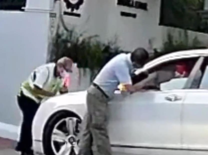 Driver seen pushing Bentley against school security officer to be charged, along with son who is car owner Driver seen pushing Bentley against school security officer to be charged, along with son who is car owner