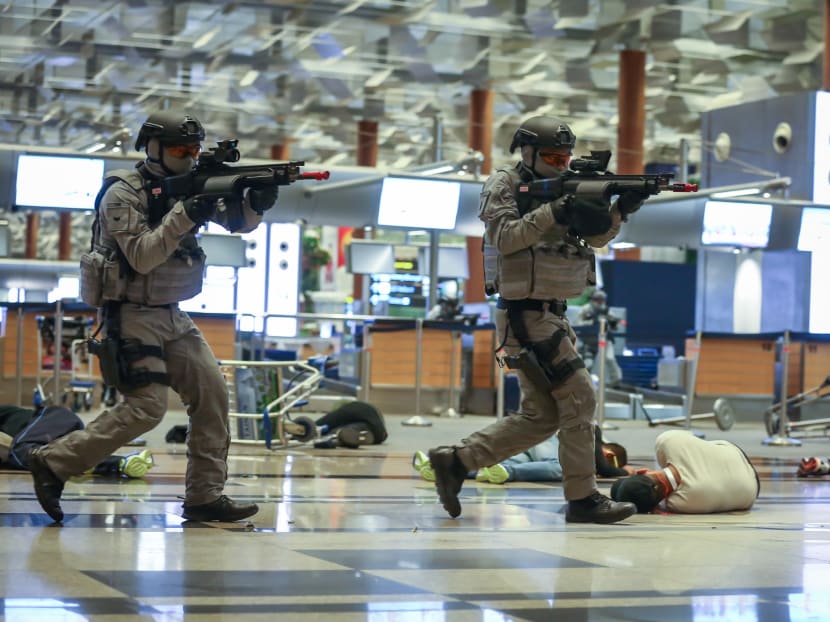 Soldiers taking part in a counter-terrorism drill at Changi Airport as part of Exercise Northstar in the early hours of Tuesday (Oct 17) morning. The drill was witnessed by Prime Minister Lee Hsien Loong and some members of the Cabinet. Photo: Nuria Ling/TODAY