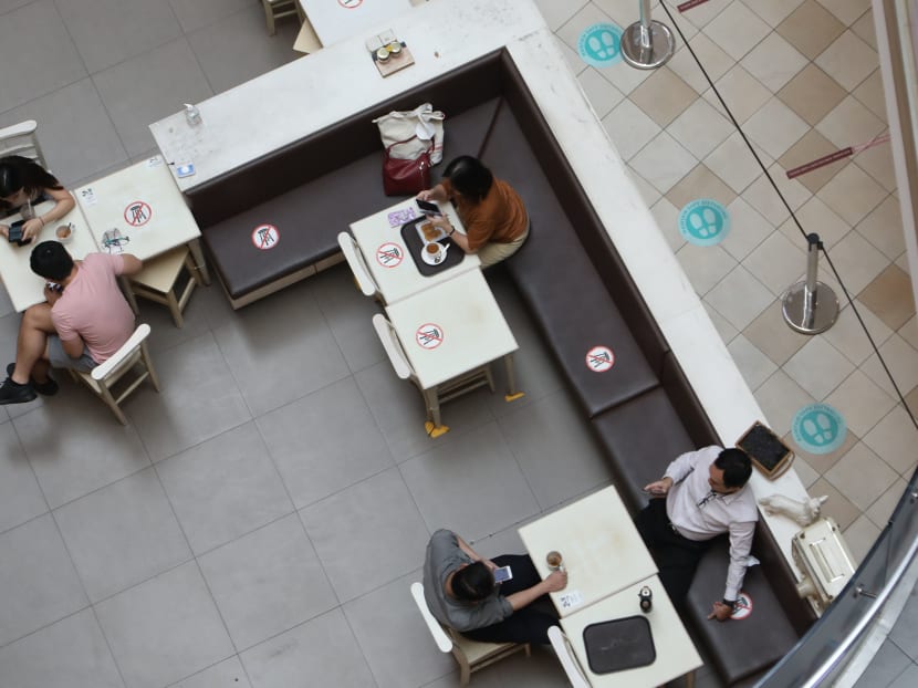 Diners at Tampines One on Sept 27, 2021, after tightening of Covid-19 restrictions in Singapore brought down group sizes for dining at eateries from five to two. Diners at Tampines One on Sept 27, 2021, after tightening of Covid-19 restrictions in Singapore brought down group sizes for dining at eateries from five to two.