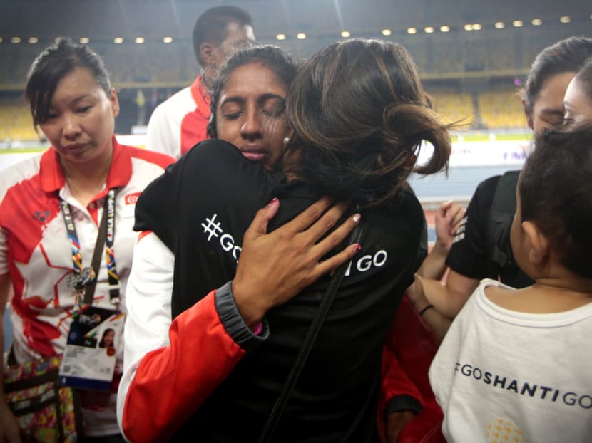 Veronica Shanti Pereira is comforted by loved ones after competing in the SEA Games womens 200m. Photo: Jason Quah/TODAY