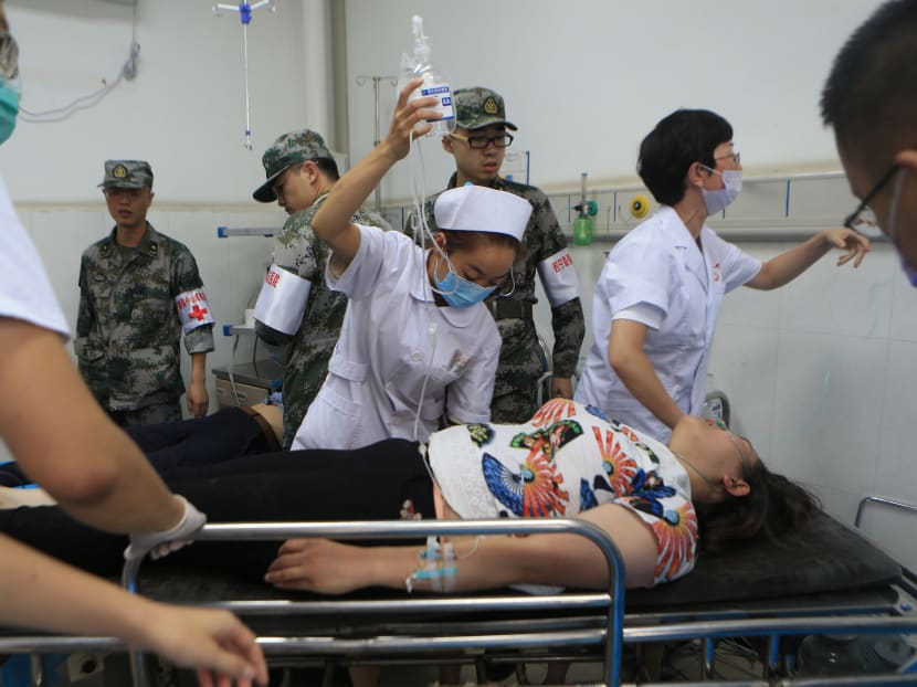 An earthquake victim receives treatment at a hospital after an earthquake in Jiuzhaigou county, Ngawa prefecture, Sichuan province, China. Photo: Reuters