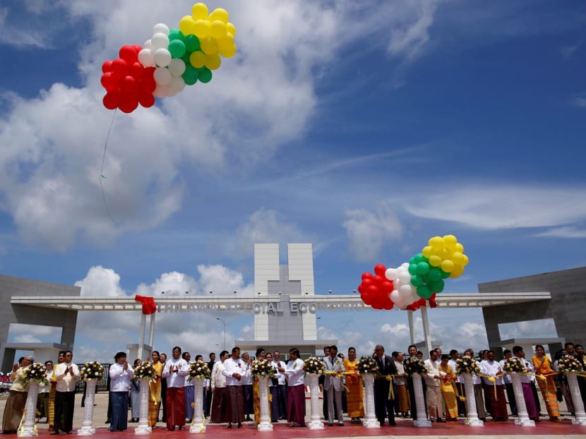 Myanmar and Japanese officials cutting ribbons during the opening ceremony of the Thilawa Special Economic Zone at Thanlyin township outside Yangon in 2015. This development attracted more than US$122 million (S$169 million) in foreign direct investment over this fiscal year. Photo: Reuters