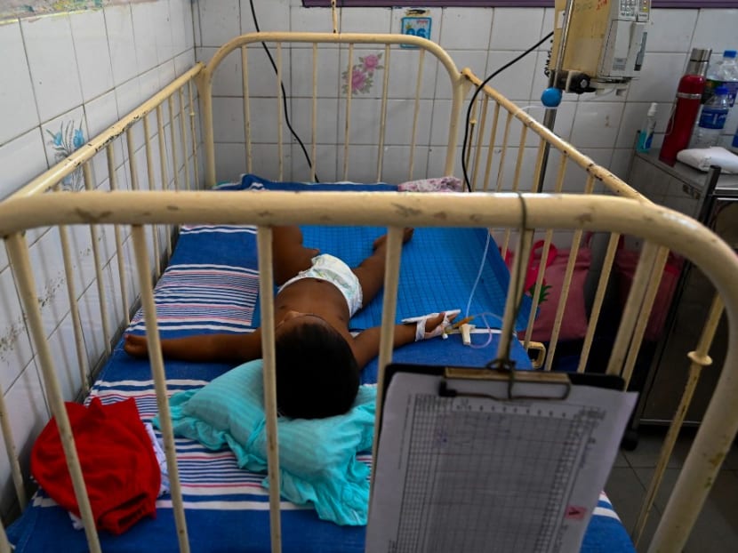 In this picture taken on April 21, 2022, a child lies in a bed in Lady Ridgeway Hospital for Children in Colombo. In this picture taken on April 21, 2022, a child lies in a bed in Lady Ridgeway Hospital for Children in Colombo.