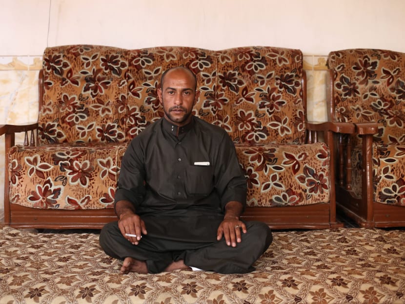 In this Monday, May 18, 2015 photo, Falah Abdullah Jamil poses for a portrait in Eski Mosul, northern Iraq. He was held as a prisoner by the Islamic State group for selling cigarettes - which are banned by the militants - and was tortured while in jail. Photo: AP