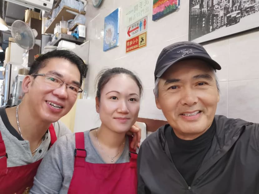Chow Yun Fat posing for a photograph at Tim Choi Kee restaurant.