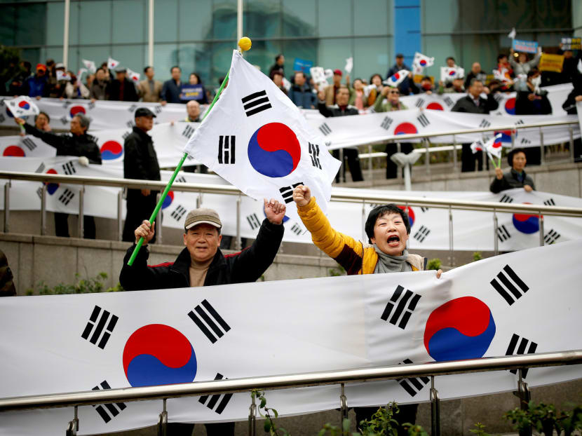 Supporters of South Korean President Park Geun-hye at a rally opposing calls for her resignation last November. Ms Park still commands an almost cult-like following among her supporters. Photo: Reuters