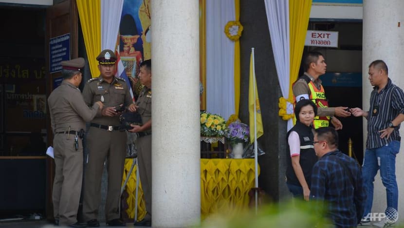 Thai clerk charged with murder after shooting gunman in court