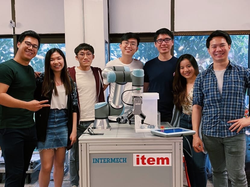 Mr Daryl Lim (far left) and his team at Augmentus, a robot programming software company.
