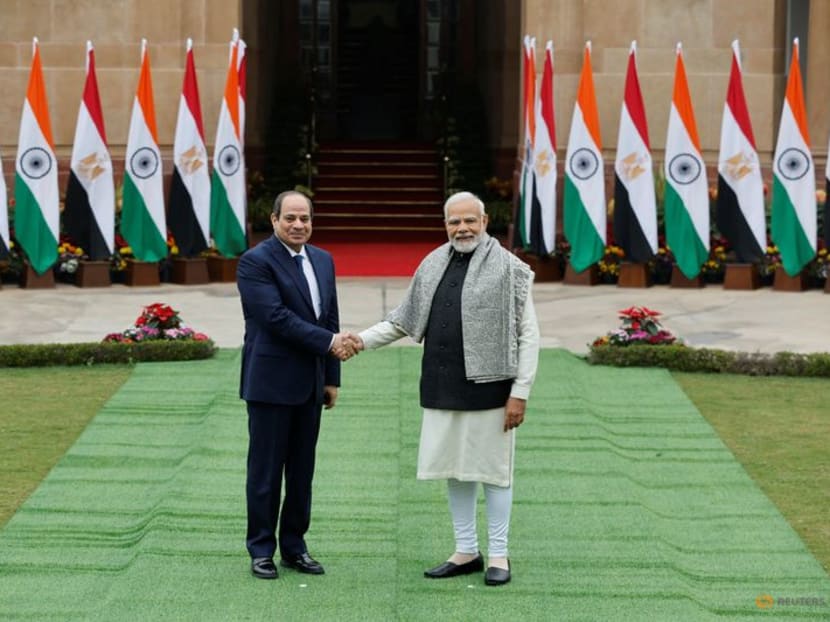 Egyptian President Abdel Fattah El Sisi shakes hands with Indian Prime Minister Narendra Modi before their meeting at the Hyderabad House in New Delhi, India, January 25, 2023. REUTERS/Adnan Abidi