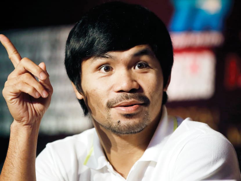 Mr Manny Pacquiao at a promotional event at a hotel in downtown Shanghai on Tuesday. He will be defending the welterweight crown he won in a rematch earlier last year with Mr Timothy Bradley. 
Photo: Reuters